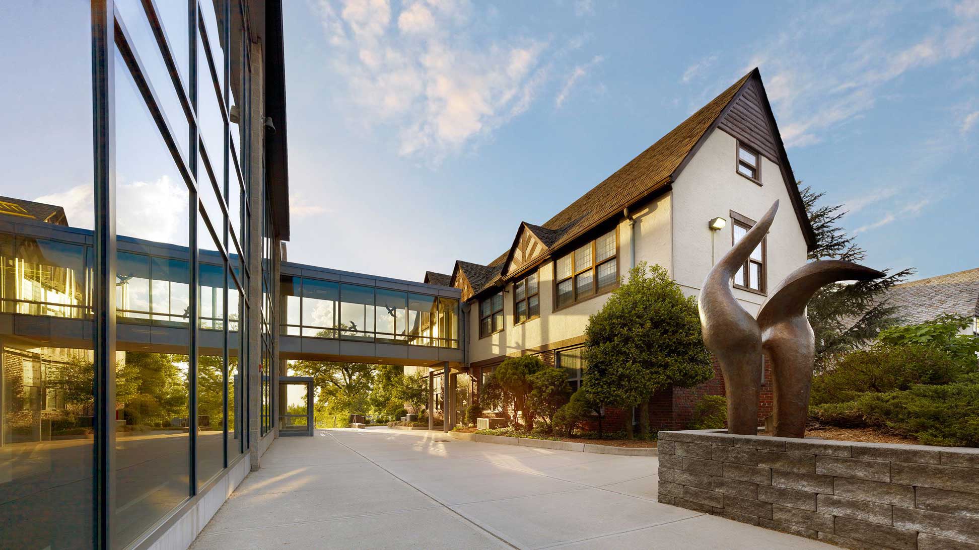 Courtyard view at Dwight-Englewood School between two buildings with skyway in between